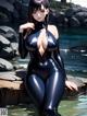 A woman in a black latex outfit standing in the water.